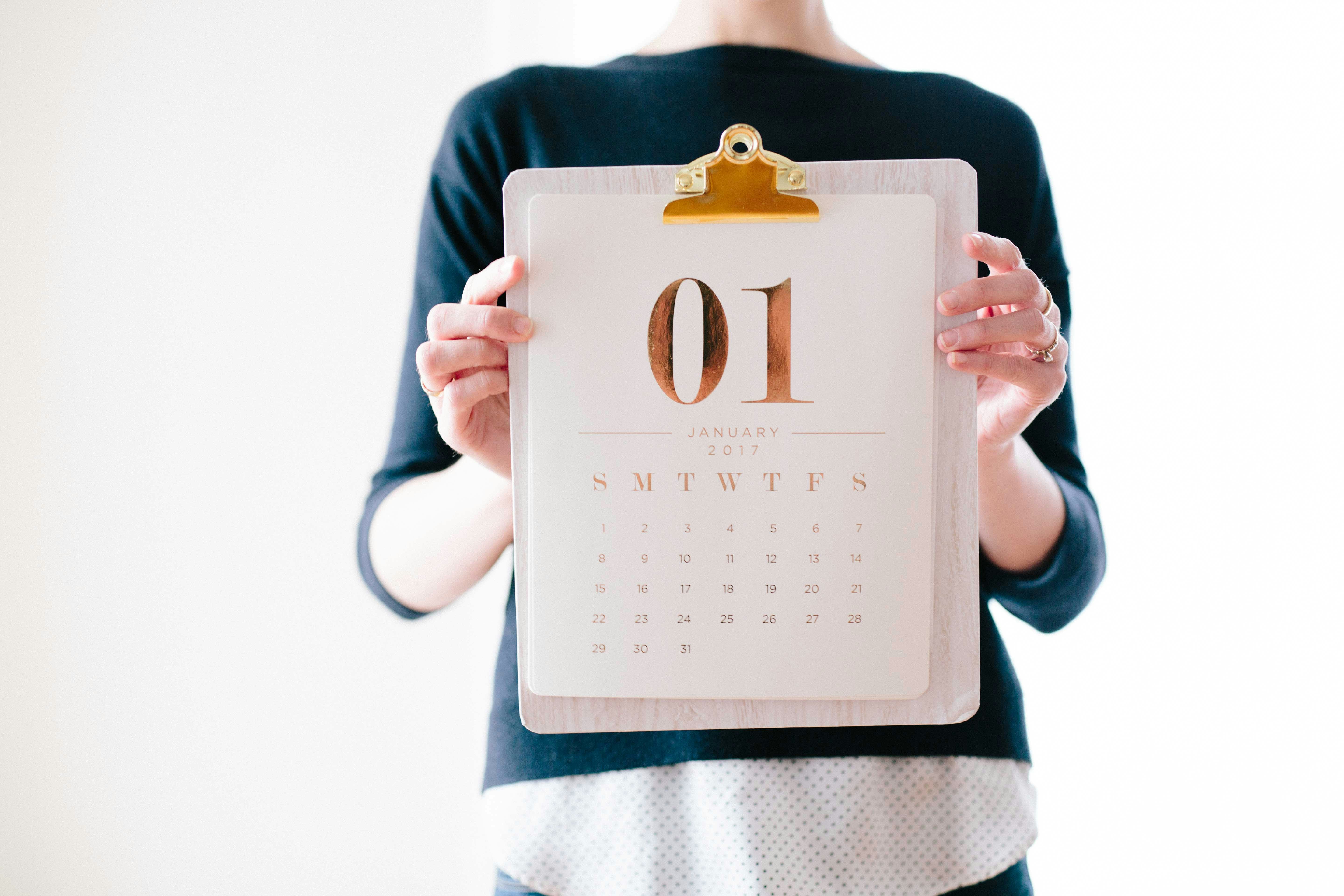 Person holding a calendar at January photo